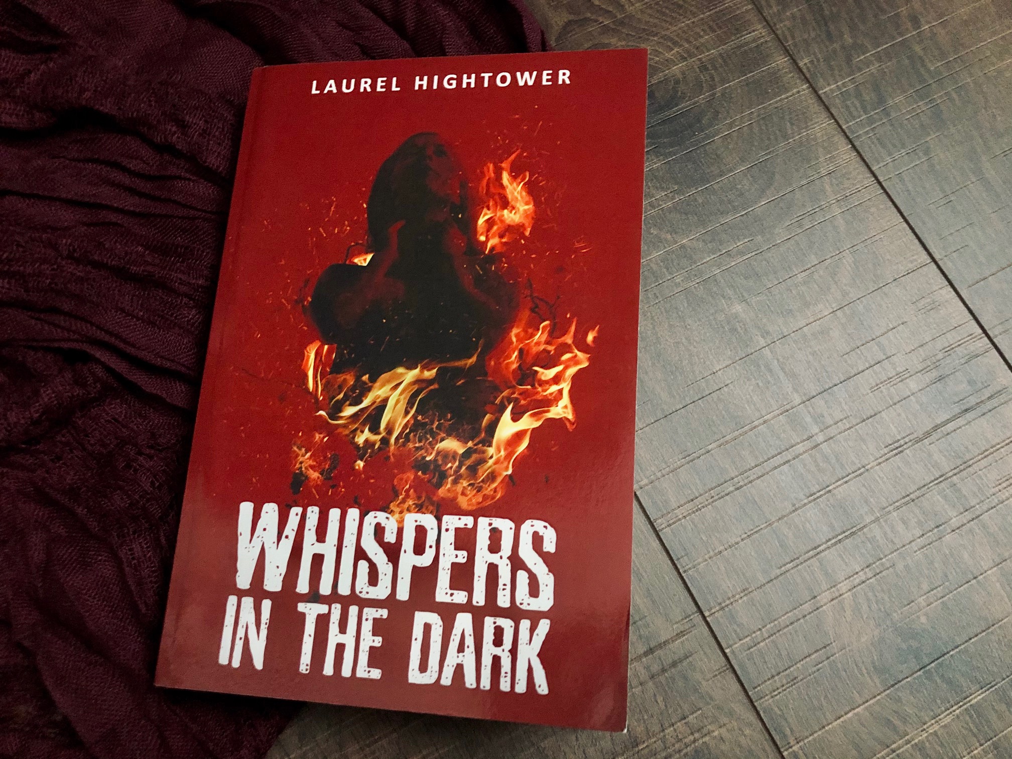 Whispers in the Dark by Laurel Hightower book photo by Erica Robyn Reads