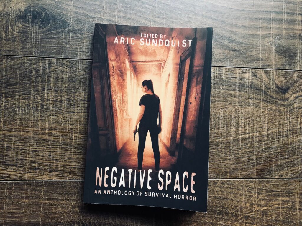 Negative Space: An Anthology of Survival Horror edited by Aric Sundquist book photo by Erica Robyn Reads