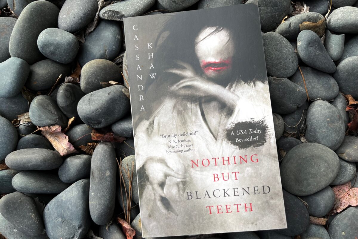 Nothing But Blackened Teeth by Cassandra Khaw book photo by Erica Robyn Reads