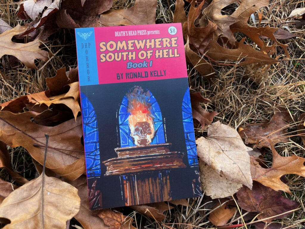 Somewhere South of Hell - Book 1 by Ronald Kelly book photo in the fall leaves by Erica Robyn Reads