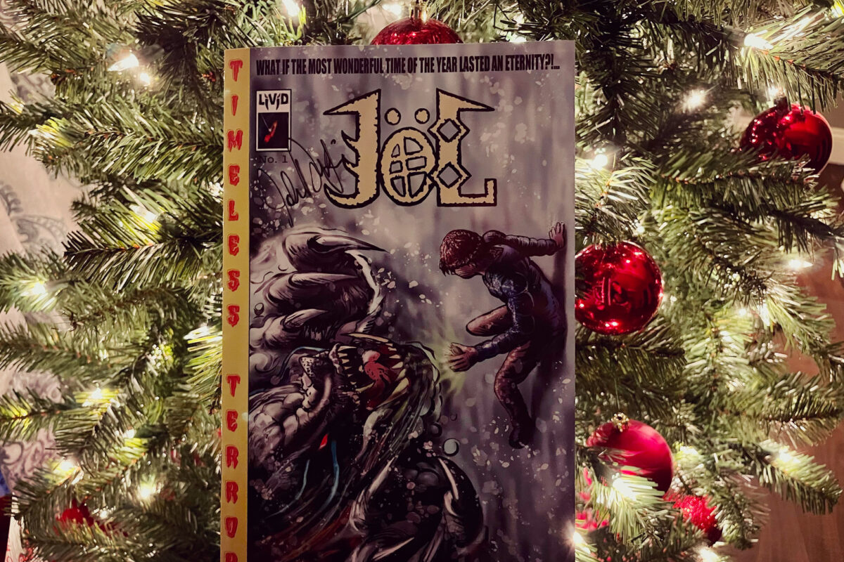 Jöl  - Issue 1 created by John Durgin and Joel Vanpatten comic photo in front of Christmas tree
