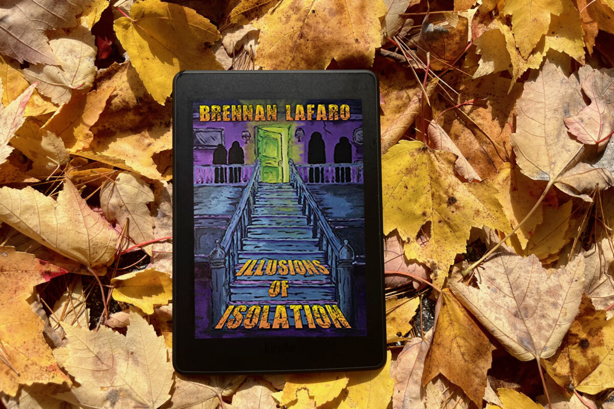 Illusions of Isolation by Brennan LaFaro book photo by Erica Robyn Reads of book in a pile of yellow leaves