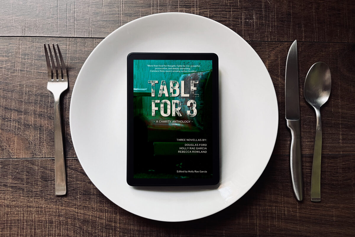 Table for 3 Anthology book photo by Erica Robyn Reads - ebook sitting in the middle of a plate setting