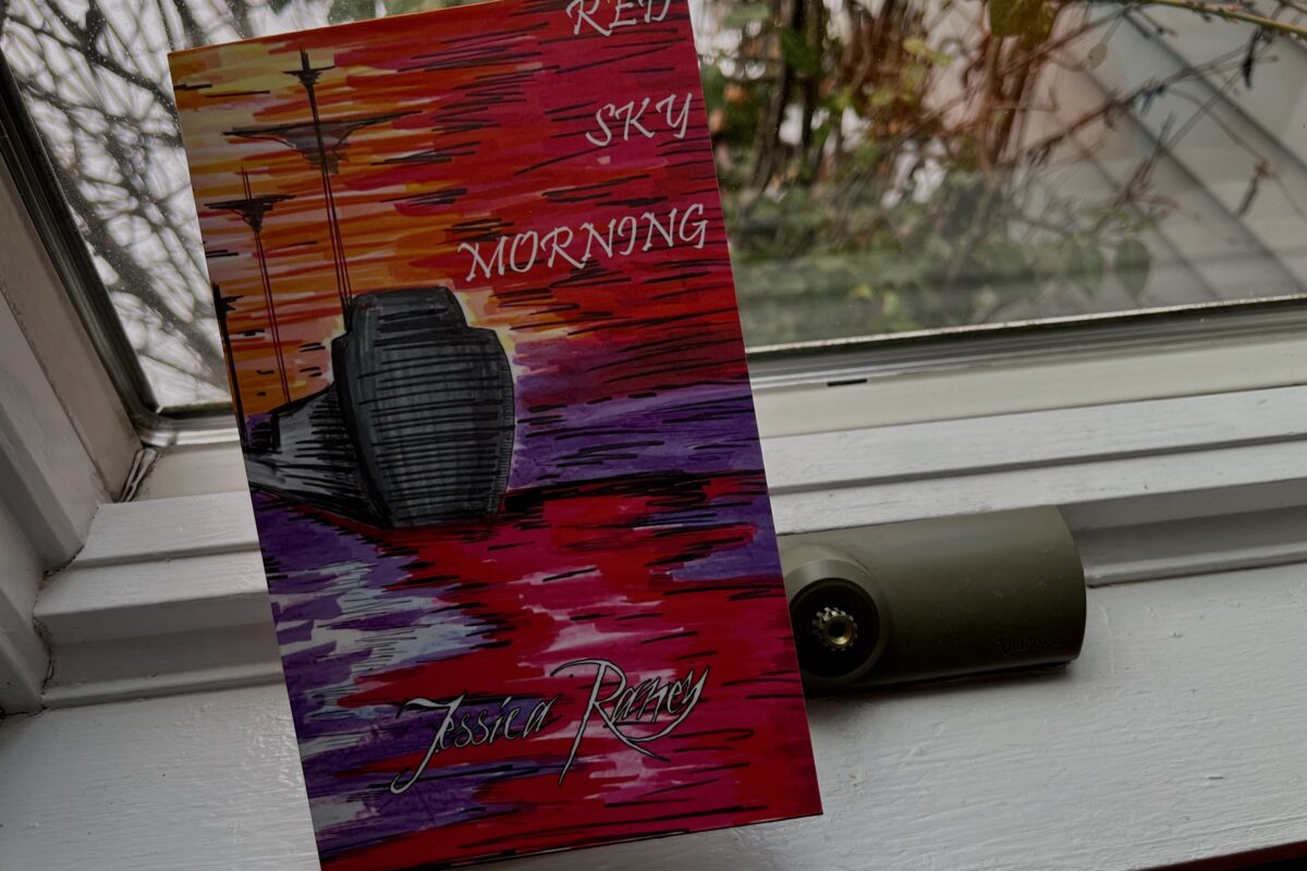 Red Sky Morning by Jessica Raney - book cover features a boat with a trail of red in the water behind it