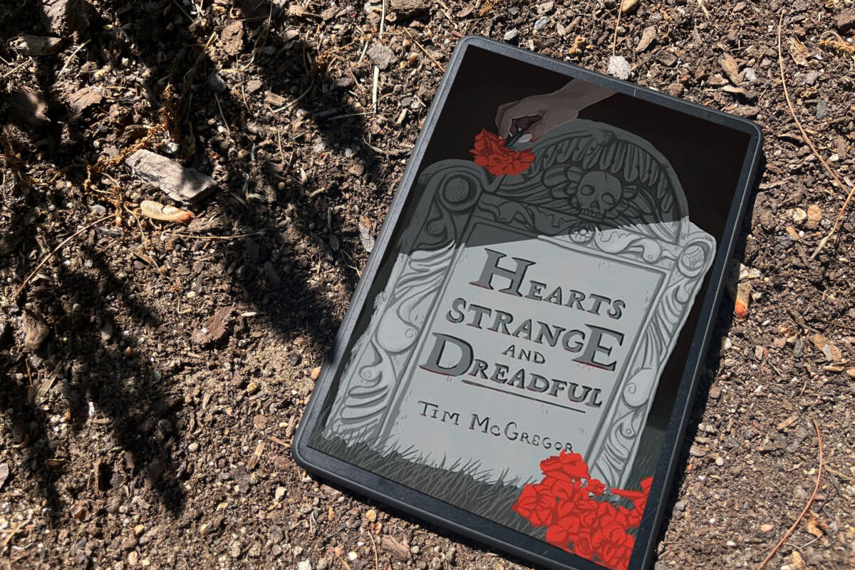 Book photo of a kindle featuring the book Hearts Strange and Dreadful by Tim McGregor